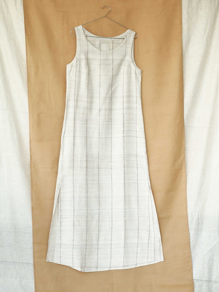Handspun and handwoven eri silk dress in a cream color with beige stripes. Naturally dyed with teak leaves. 100% natural fiber. Ethically made, slow fashion.