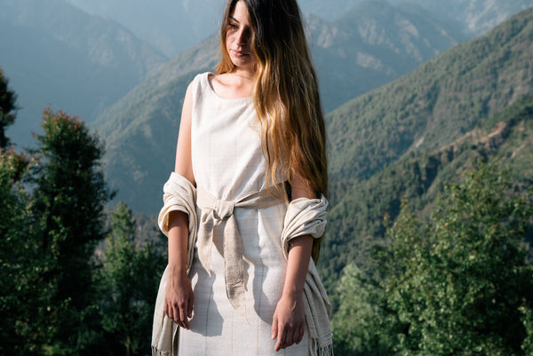 Handspun and handwoven eri silk dress in a cream color with beige stripes. Naturally dyed with teak leaves. 100% natural fiber. Ethically made, slow fashion.