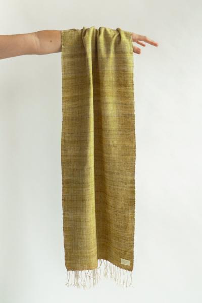 Scarf made from organic peace silk on a handloom in India. Eri silk scarf from India handspun and handwoven in a mustard color. Naturally dyed with red onion skins. Organic and natural material, 100% peace silk. Slow and ethically made.  