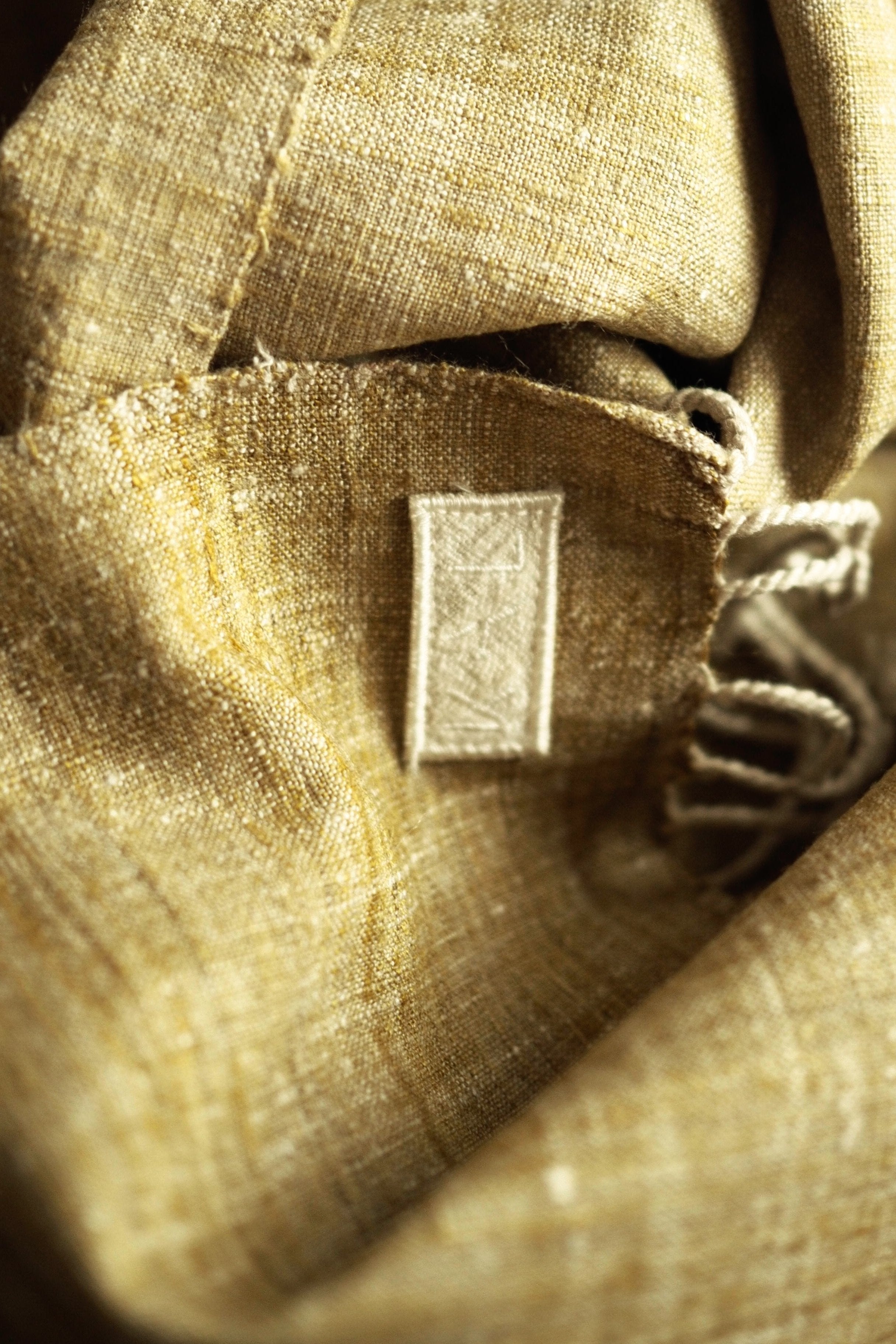 Scarf made from organic peace silk on a handloom in India. Eri silk scarf from India handspun and handwoven in a mustard color. Naturally dyed with red onion skins. Organic and natural material, 100% peace silk. Slow and ethically made.  