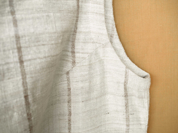 Handspun and handwoven eri silk dress in a cream color with beige stripes. Naturally dyed with teak leaves. 100% natural fiber. Ethically made, slow fashion.