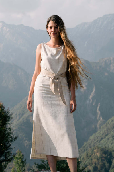 Handspun and handwoven eri silk dress in a cream color with beige stripes. Naturally dyed with teak leaves. 100% natural fiber. Ethically made, slow fashion.