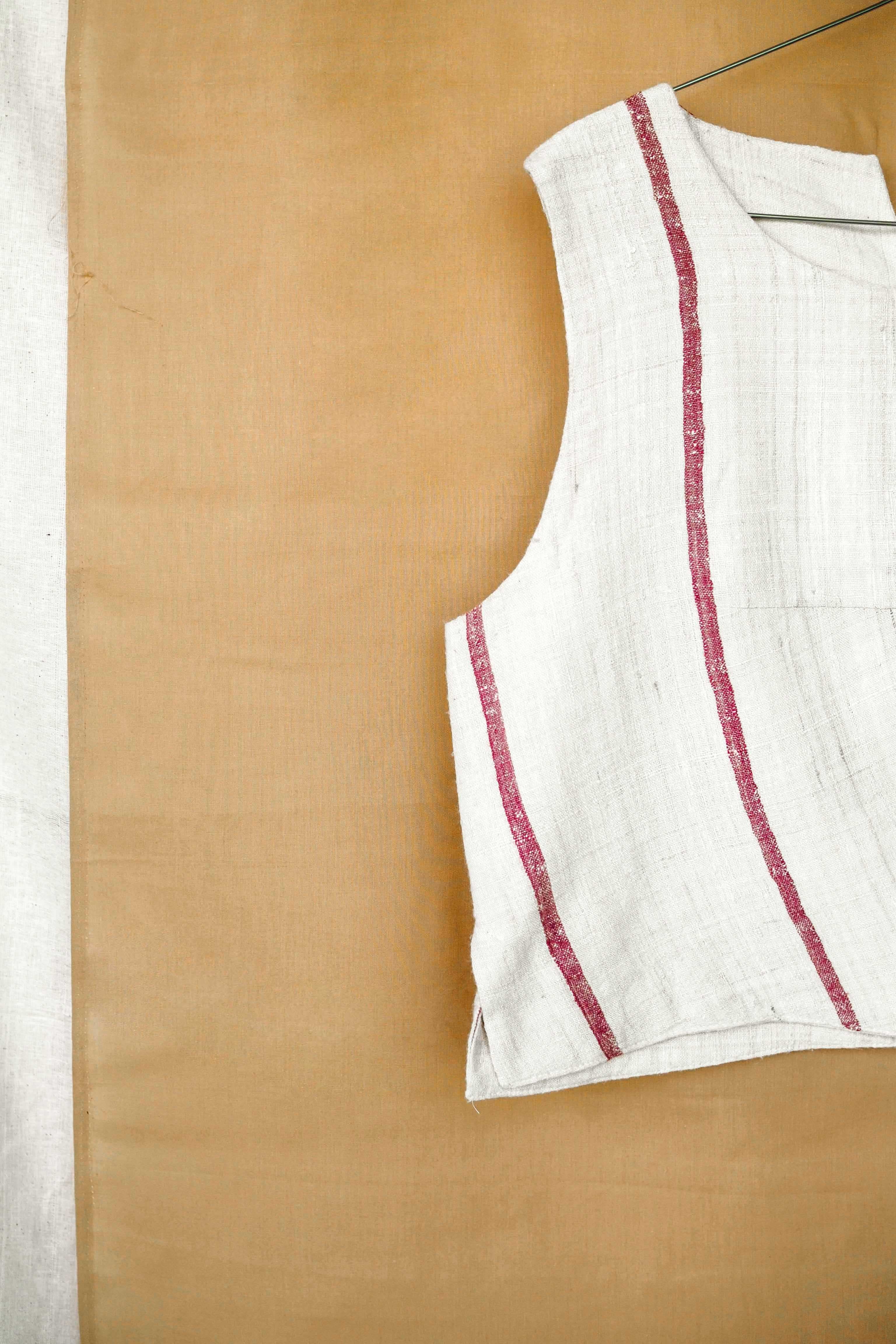 Handspun and handwoven eri silk top in a pink and cream color. 100% natural fiber and naturally dyed with lac. Ethically made, slow fashion, simplicity.