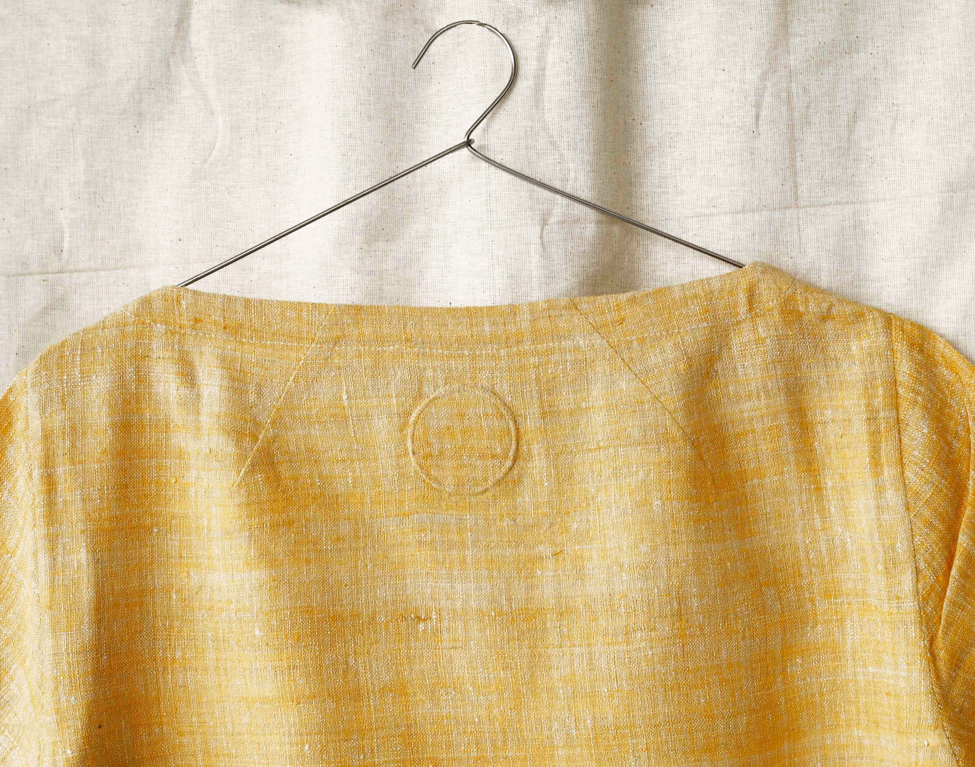Handspun and handwoven eri silk shirt in a yellow color. 100% natural fiber and naturally dyed with turmeric. Ethically made, slow fashion, simplicity.