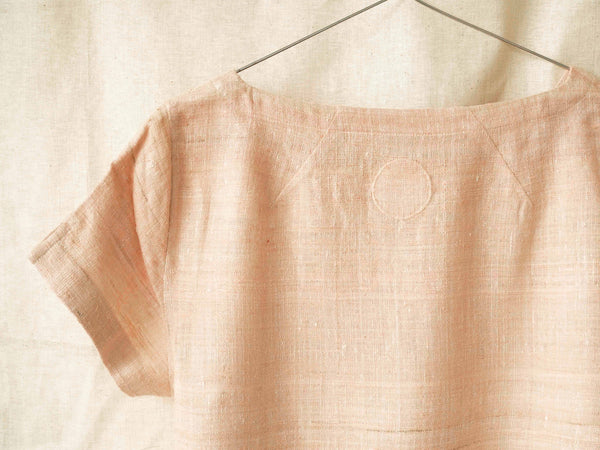 Handspun and handwoven eri silk shirt in a salmon and apricot color. 100% natural fiber and naturally dyed with Indian madder roots. Ethically made, slow fashion, simplicity.