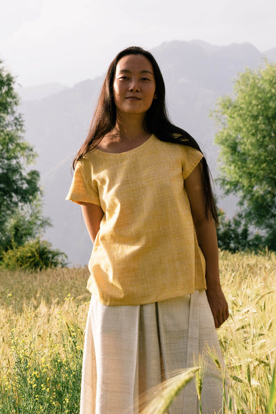 Handspun and handwoven eri silk shirt in a yellow color. 100% natural fiber and naturally dyed with turmeric. Ethically made, slow fashion, simplicity.