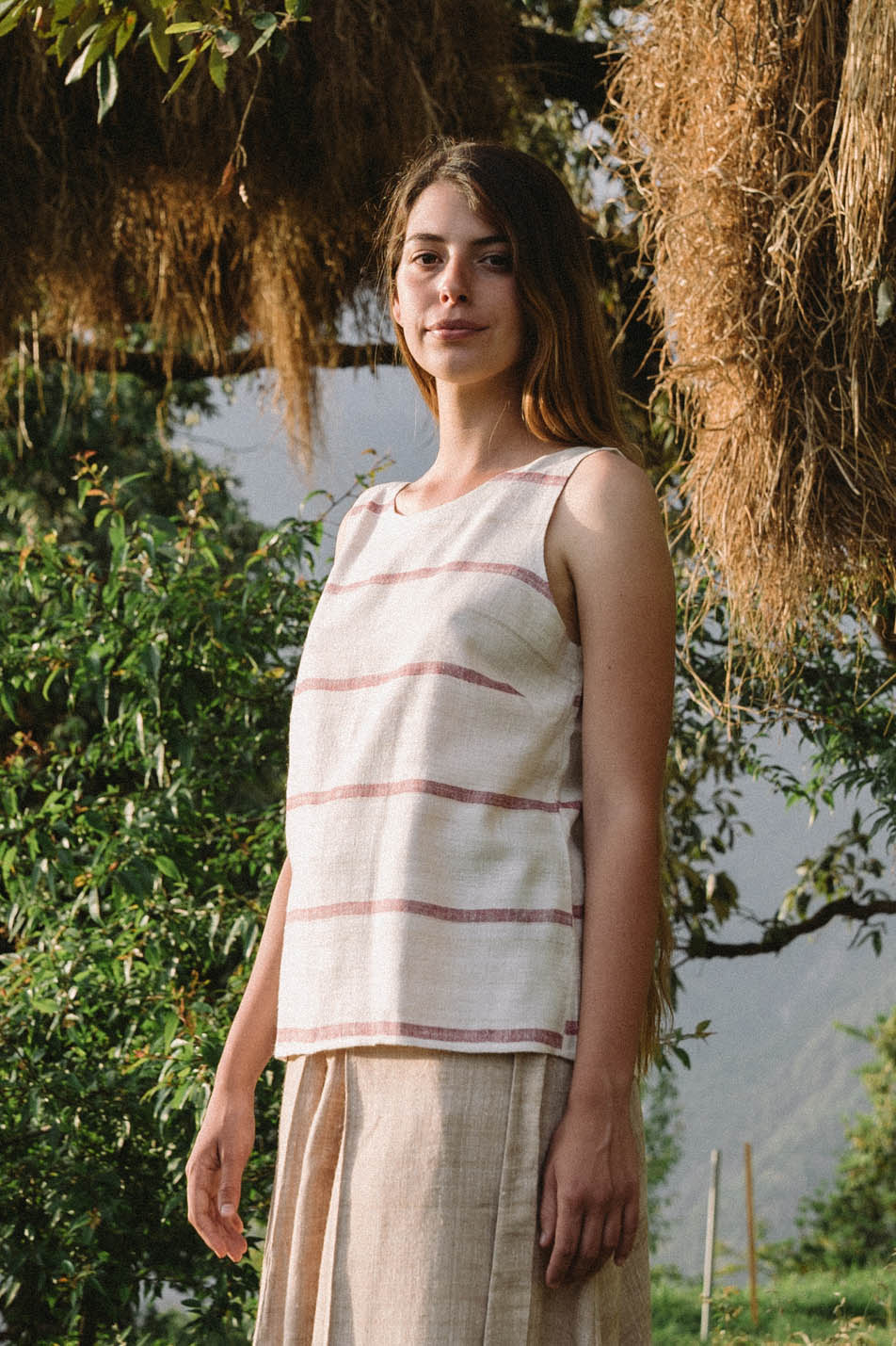 Handspun and handwoven eri silk top in a pink and cream color. 100% natural fiber and naturally dyed with lac. Ethically made, slow fashion, simplicity.