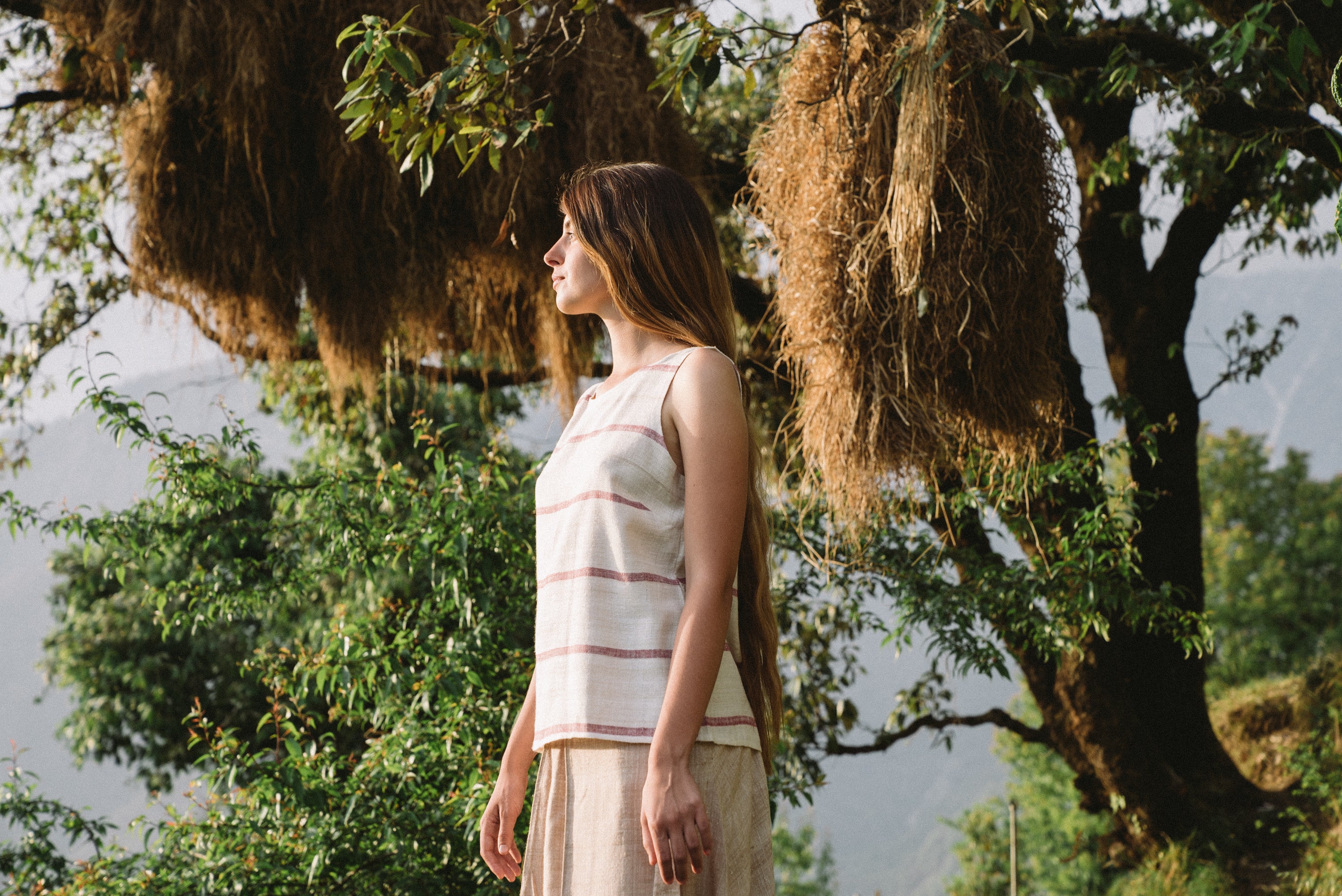 Handspun and handwoven eri silk top in a pink and cream color. 100% natural fiber and naturally dyed with lac. Ethically made, slow fashion, simplicity.