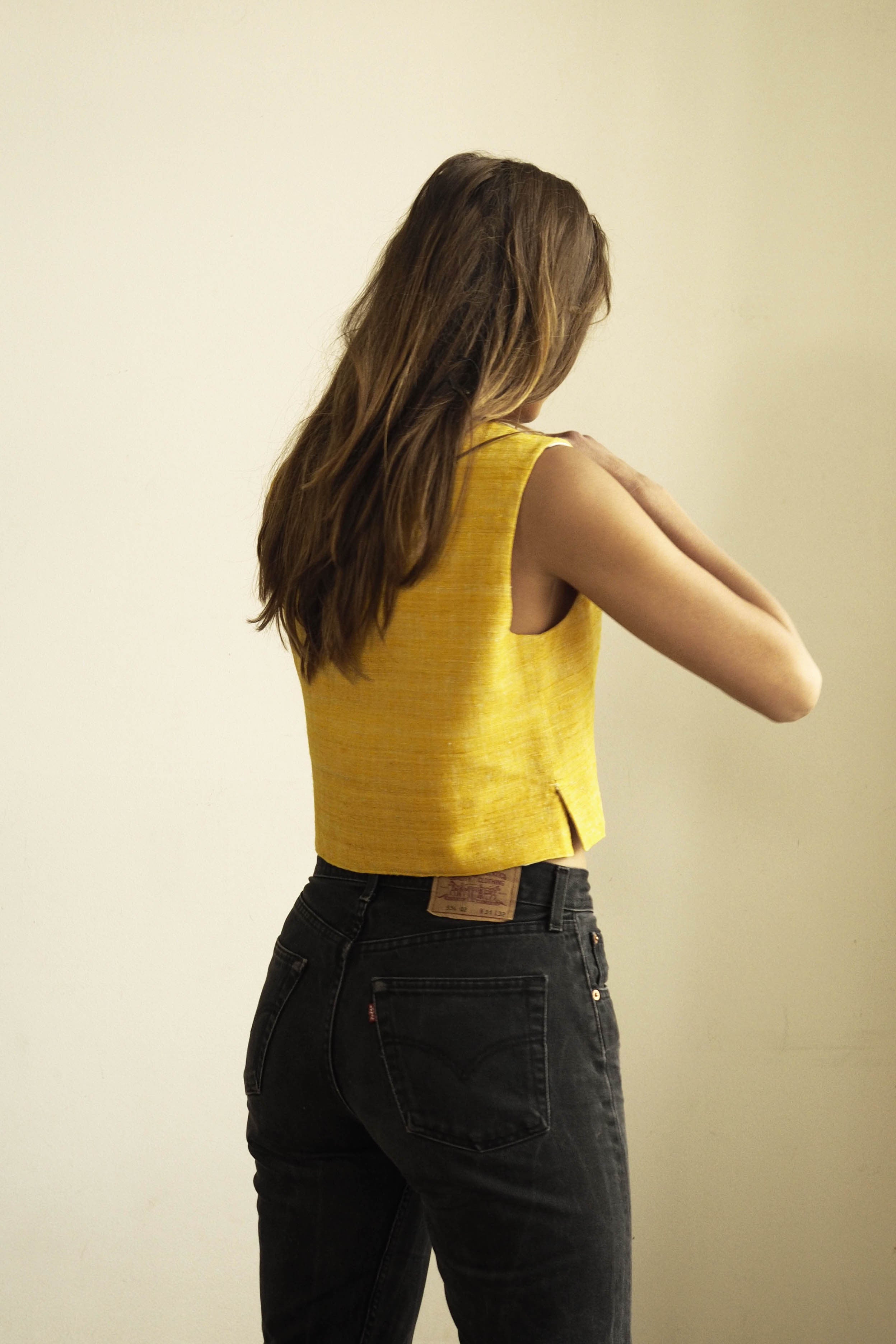 Handspun and handwoven eri silk top in a yellow color. 100% natural fiber and naturally dyed with turmeric. Ethically made, slow fashion, simplicity.