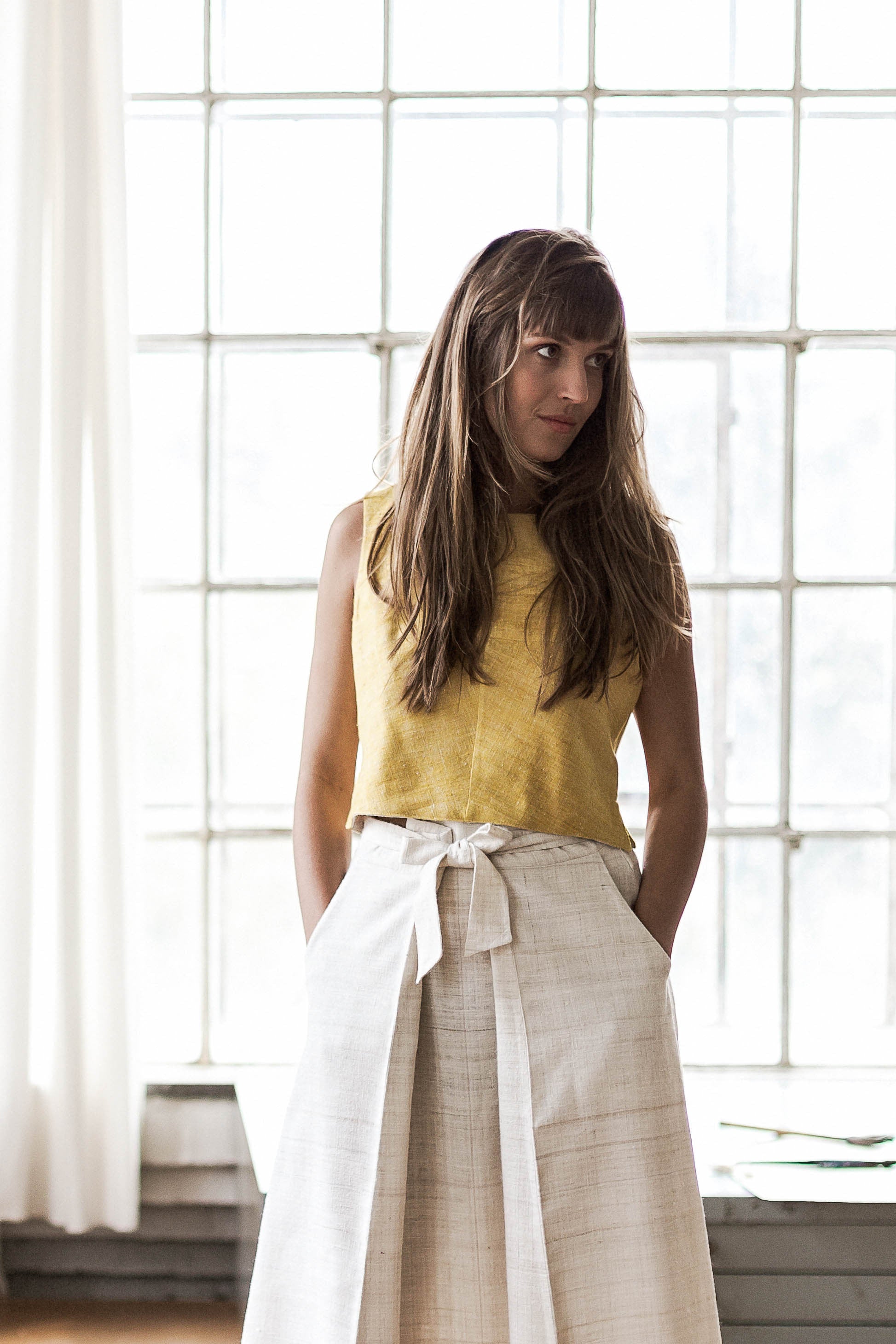 Handspun and handwoven eri silk top in a yellow color. 100% natural fiber and naturally dyed with turmeric. Ethically made, slow fashion, simplicity.