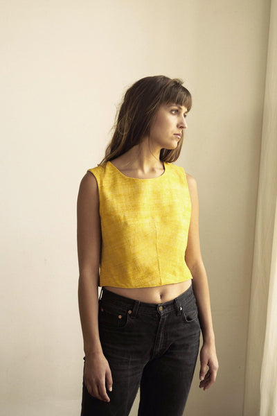 Handspun and handwoven eri silk top in a yellow color. 100% natural fiber and naturally dyed with turmeric. Ethically made, slow fashion, simplicity.
